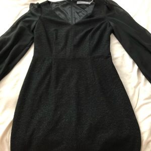 Black long sleeve, medium length dress